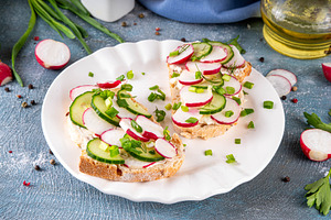 Breakfast sandwiches with cream cheese, radishes, cucumber and f, a Food & Drink Photo by Rimma