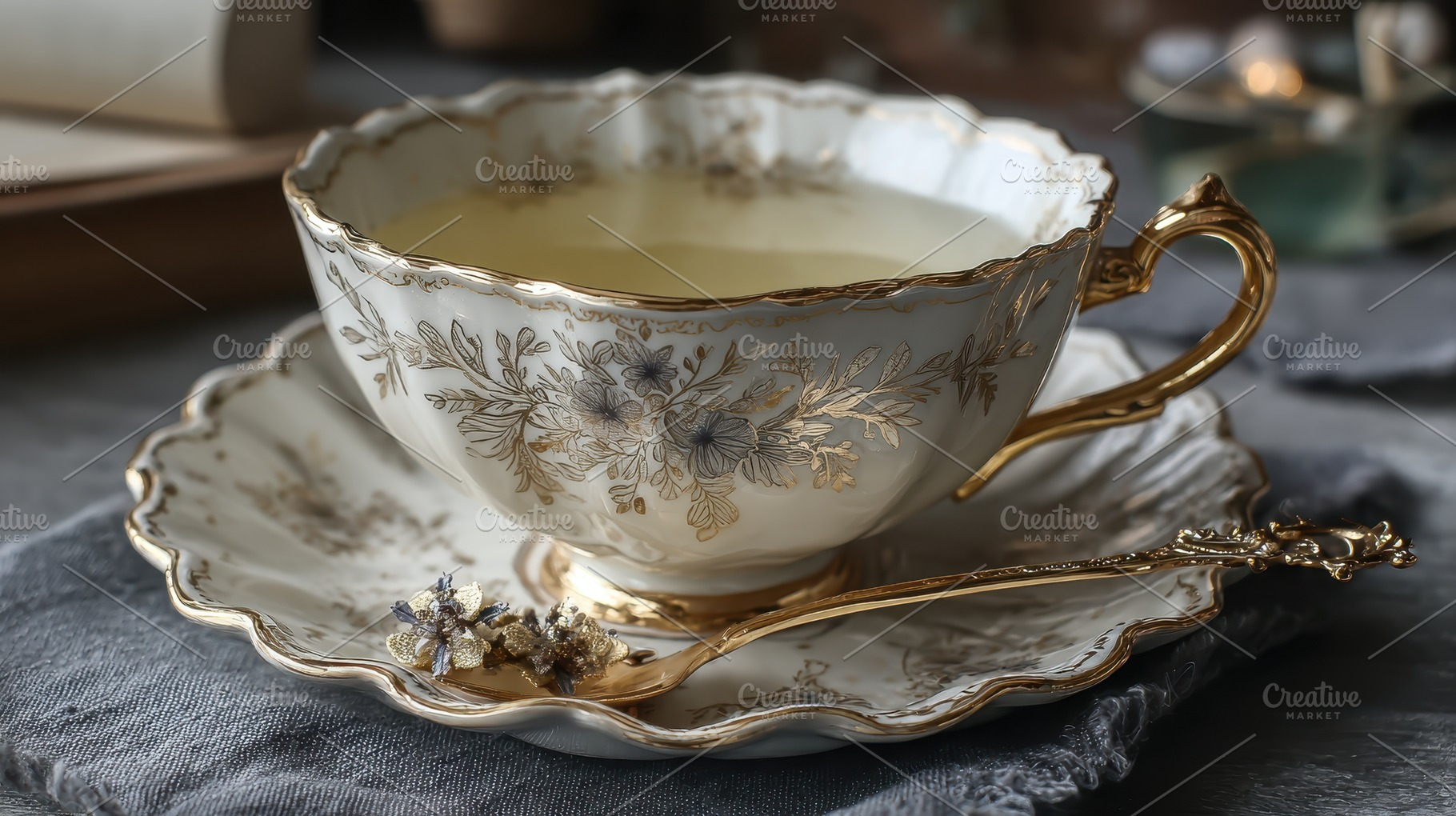 Elegant teacup saucer and spoon gold, a Photo by Pixeness Studio