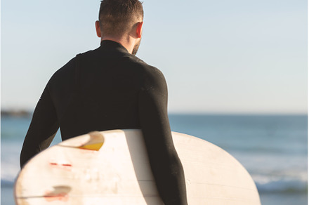 An athletic man surfer in a wetsuit, a Sports & Recreation Photo by Barcelona_dreams