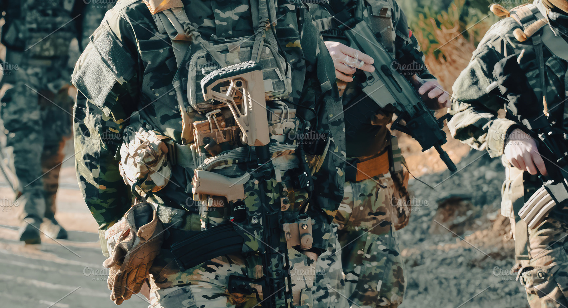 Soldiers walking with rifles and tactical gear during a military ...