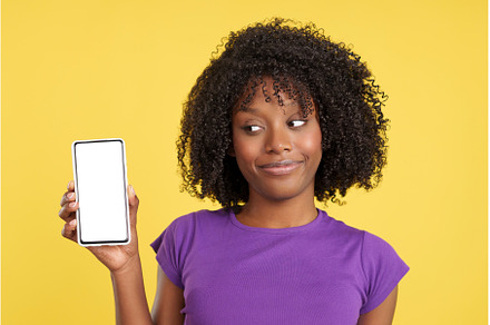 Curious afro woman looking to a, a Person Photo by Iván Moreno STOCK PHOTO