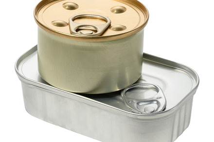 Oval and round tin can on isolated background, stack, a Food & Drink Photo by ndanko