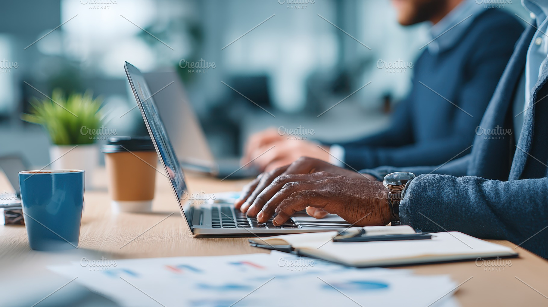 Businessman working on laptop in mod, a Photo by Pixeness Studio