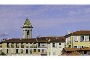 Colorful buildings and church tower, an Architecture Photo by Media Whale Stock