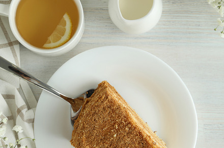 Concept of tasty dessert with honey cake, top view, a Food & Drink Photo by AtlasStudio PRO