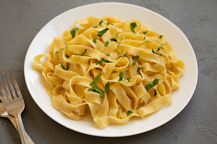 Homemade One Pot Garlic Parmesan Pasta with Parsley, side view., a Food & Drink Photo by LiudmylaChuhunova