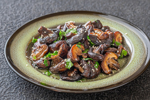 Pan fried shiitake mushrooms with sesame seeds on artisanal cera, a Food & Drink Photo by Alexander Prokopenko