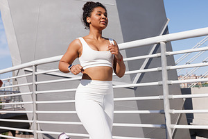 Young woman in white sportswear, a Sports & Recreation Photo by Artem Varnitsin