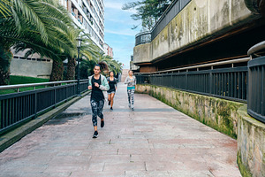 Women runners training over urban runway with palm trees, a Sports & Recreation Photo by davidpereiras