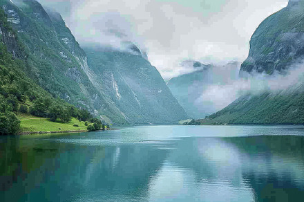 Serene waters reflect the towering,, a Photo by Tanuart