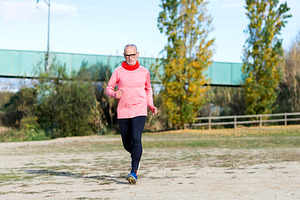 Senior man running outdoors in sportswear, a Sports & Recreation Photo by RF Images
