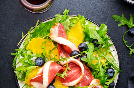 Delicious salad with smoked duck, oranges, blueberries and arugu, a Food & Drink Photo by 5PH