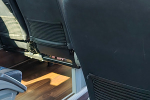 Side view of clean modern bus seats, a Transportation Photo by DanFLCreativo