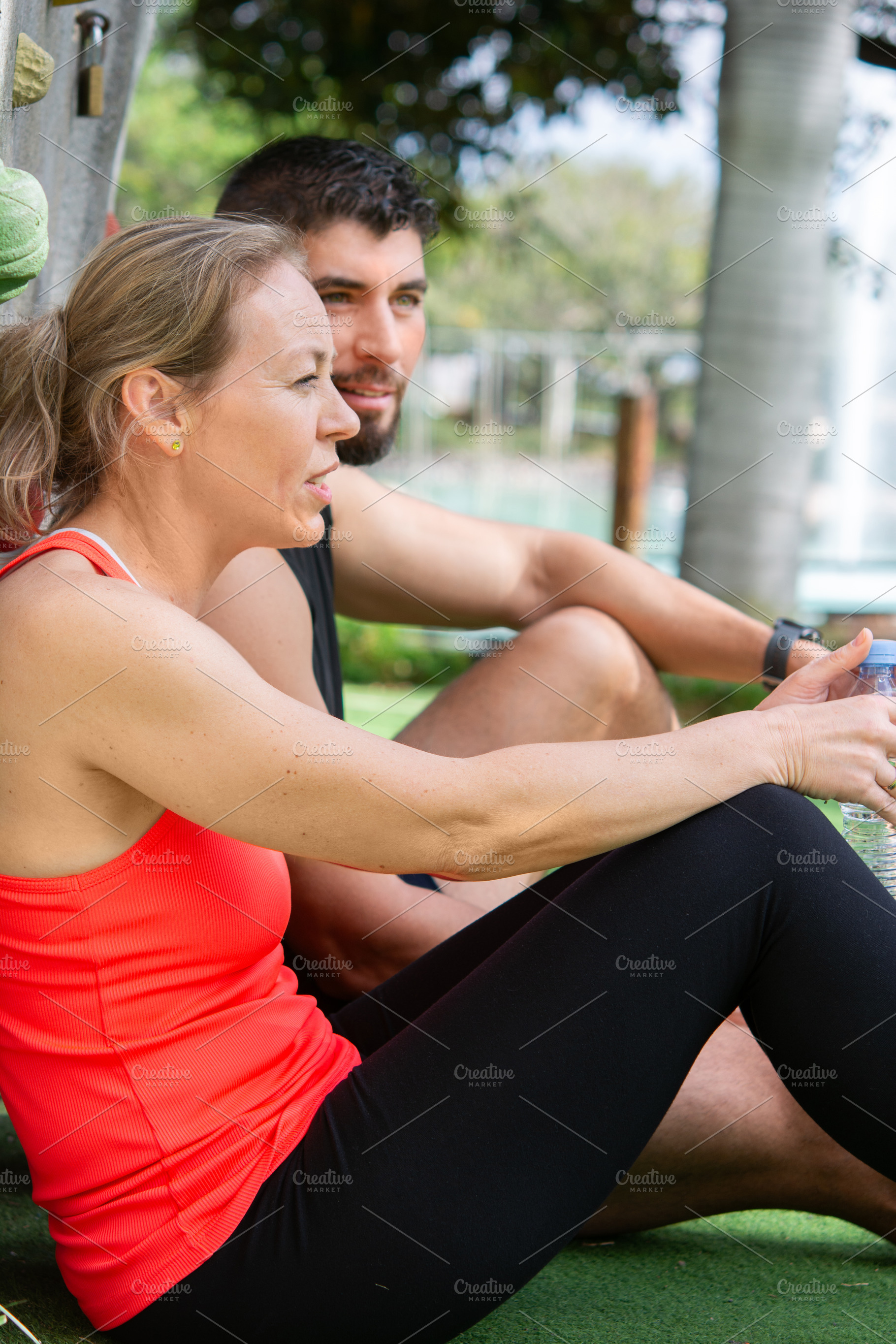 Fit couple resting after workout outdoors, healthy lifestyle and recovery conce, a Person Photo by etorres69