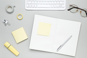Organized workspace with stationery, keyboard, glasses and notebook creating pr, a Photo by matucha