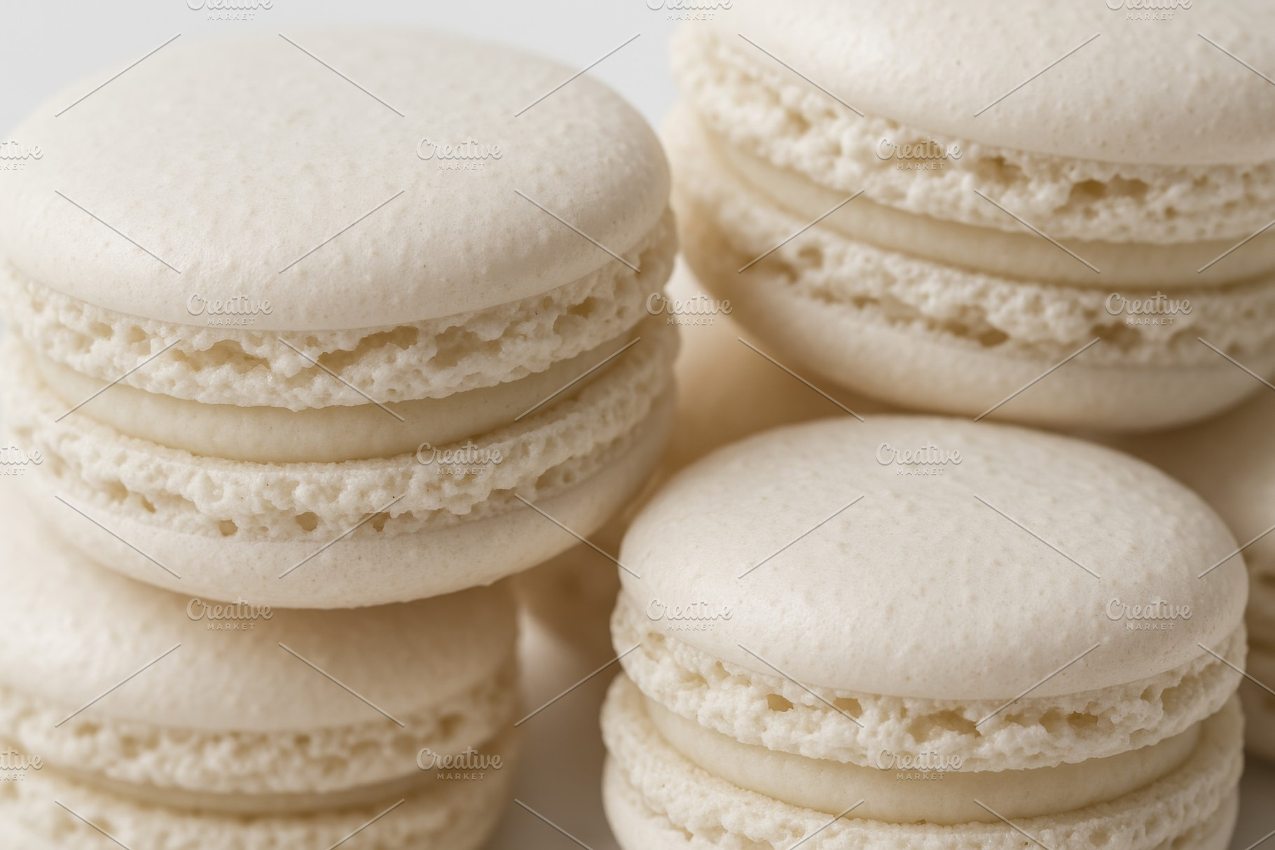 White macarons closeup showcasing delicate texture and creamy fi, a Photo by Dvoevnore photos