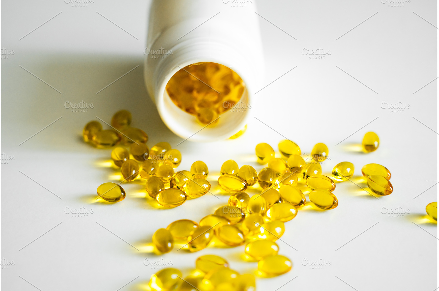 Golden yellow softgel capsules, a Health & Medical Photo by volodymyrshtun13795