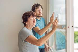 Older woman and her adult son, a Person Photo by Elizaveta Galitskaya