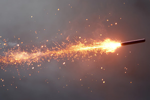 A close-up shot of a sparkler igniting in the darkness, creating a trail of bri, a Background Photo by ImageMir