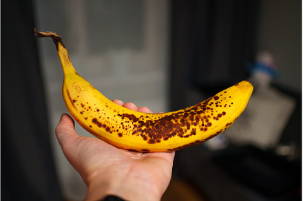 Brightly colored banana with brown