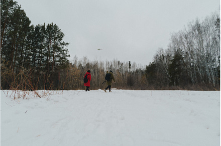 Two individuals dressed warmly in