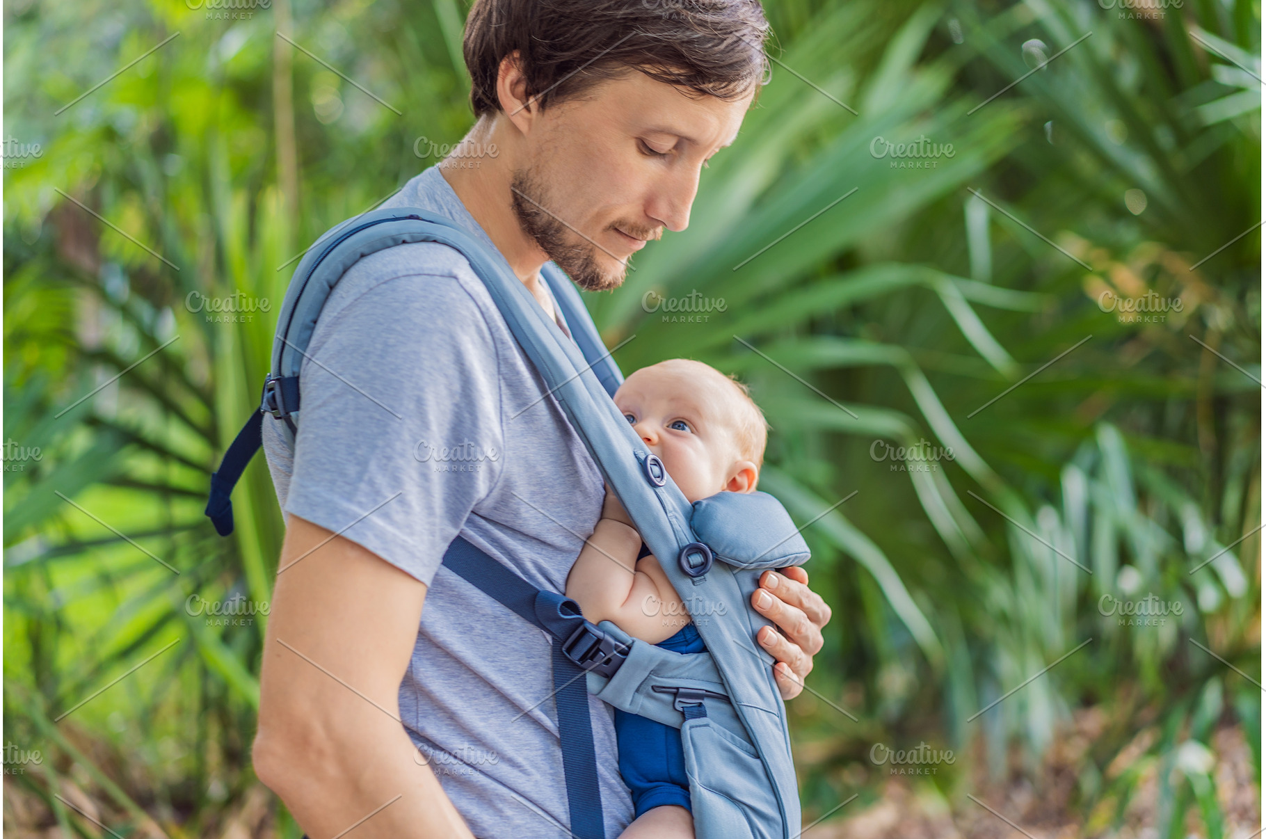 Young father walks in nature with, a Person Photo by Elizaveta Galitskaya