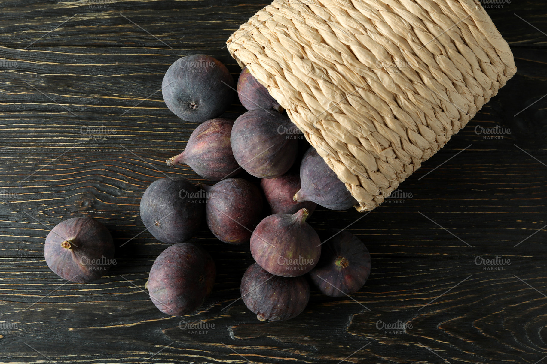 Wicker pot with fig on rustic wooden background, a Food & Drink Photo by AtlasStudio PRO