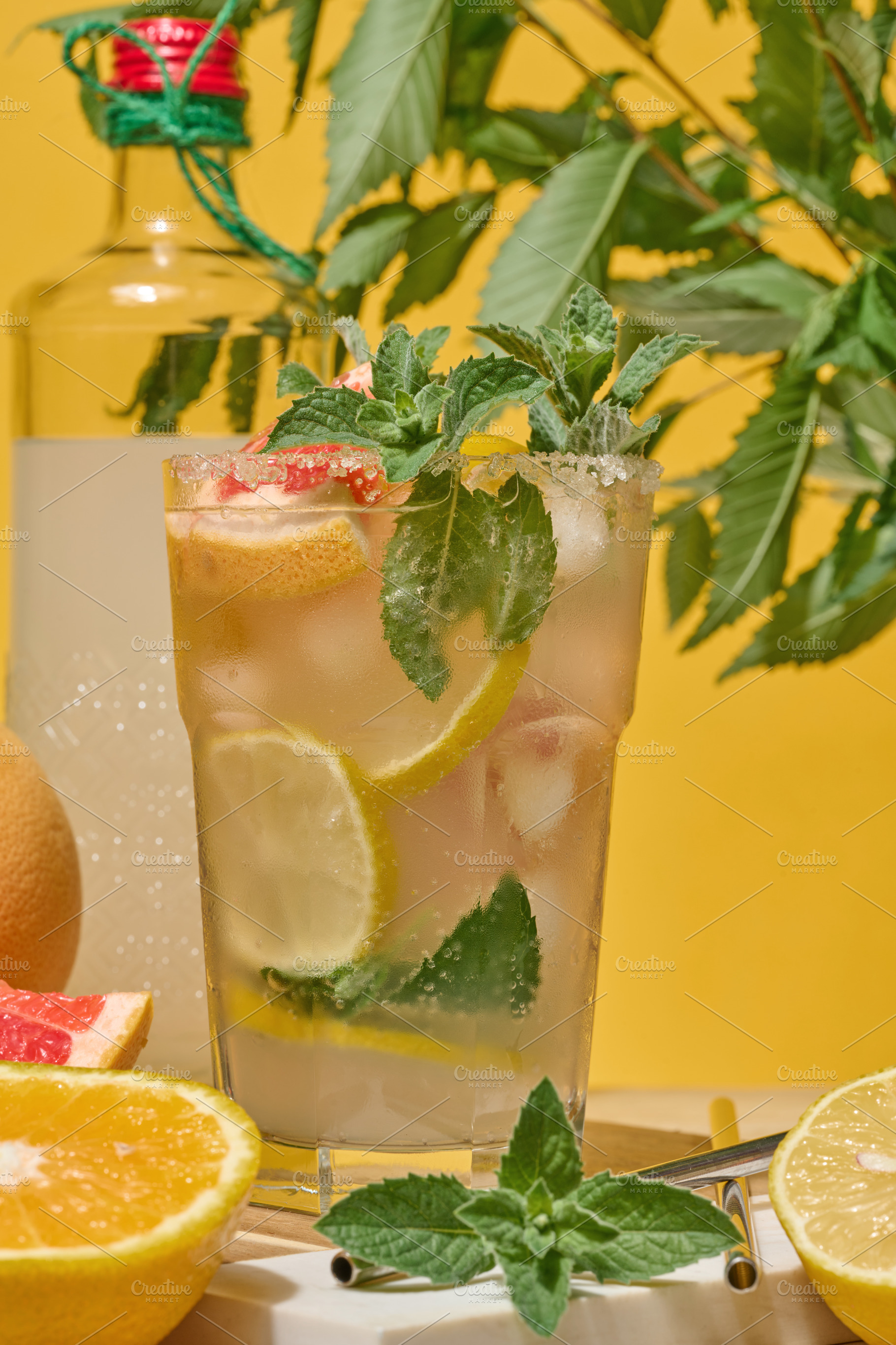 Glass with cool drink garnished with mint, lemon and grapefruit., a Food & Drink Photo by ndanko
