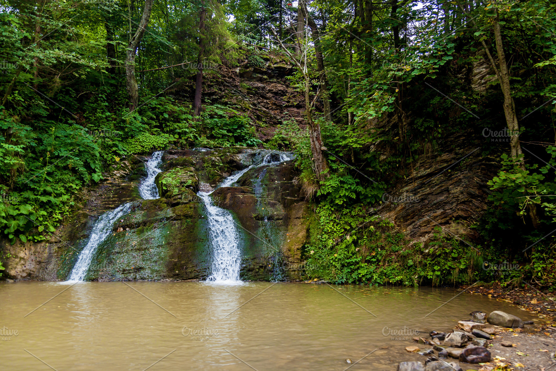 Forest waterfalls in the mountains, a Nature Photo by Photostock