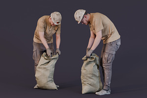 Worker Picking Up Garbage In A Bag