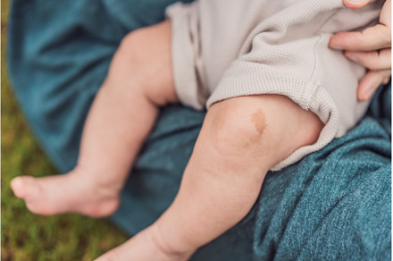 Tiny baby feet, adorned with a, a Person Photo by Elizaveta Galitskaya