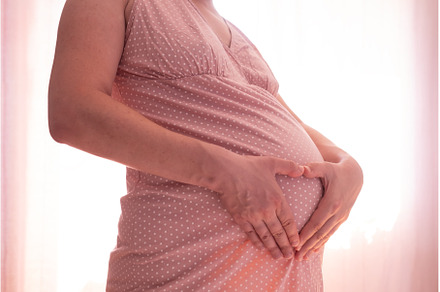 Pregnant woman touching belly, a Person Photo by Koldunova