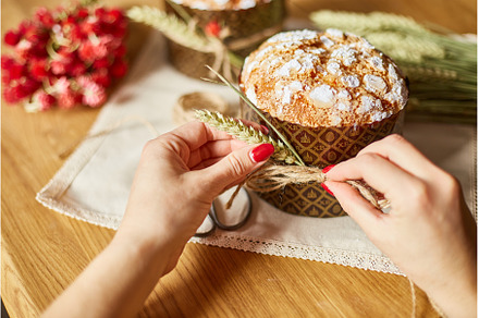 Woman hand preparing cake with, a Holiday Photo by IlliaBondarPhotography