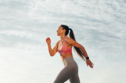 Sportswoman with long hair running, a Sports & Recreation Photo by Artem Varnitsin