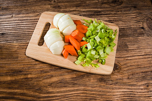 Vegetable mirepoix on a cutting board stock photo containing carrots and food