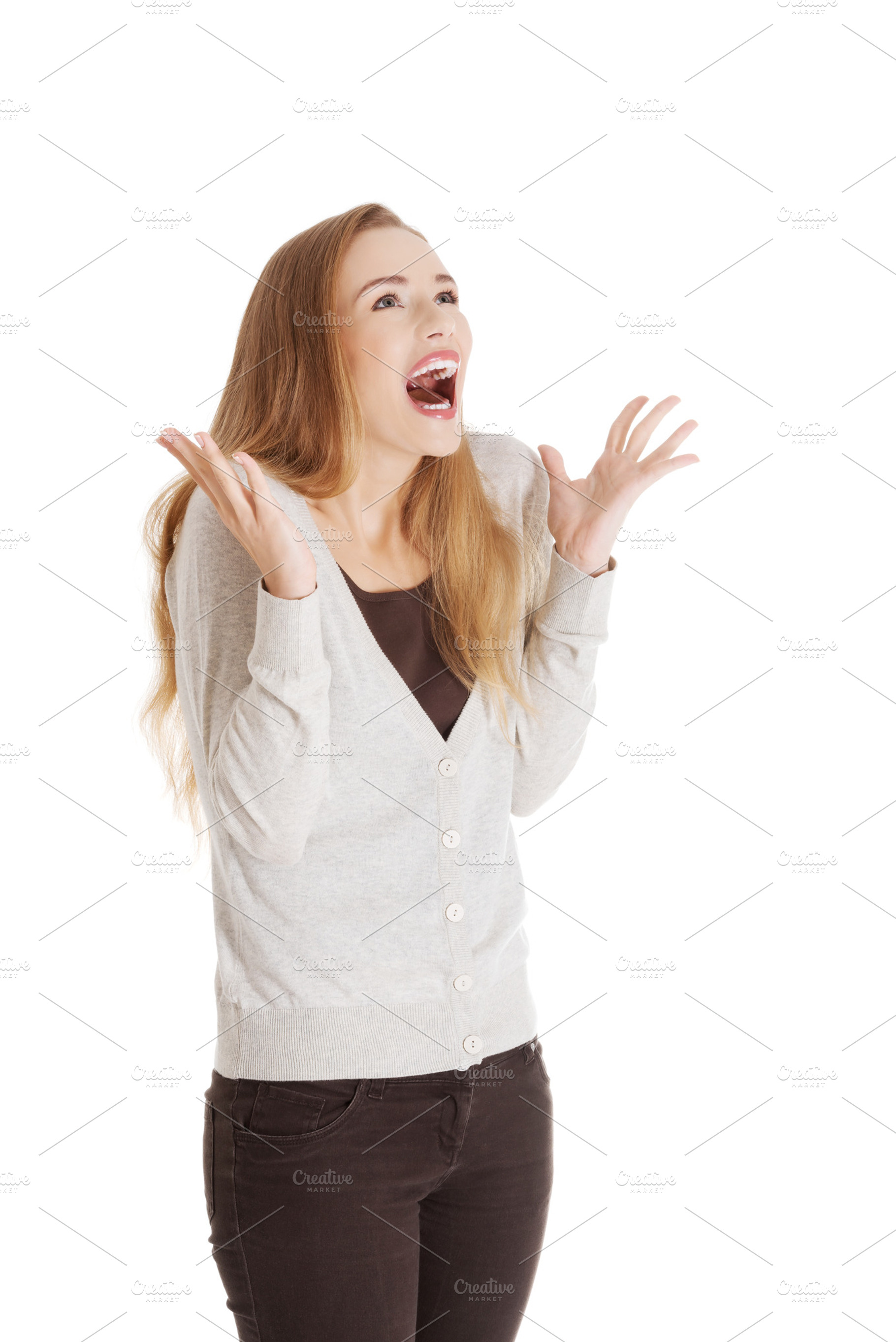 Beautiful positive and casual woman expressing surprise stock photo, a Person Photo by PhotoMediaGroup