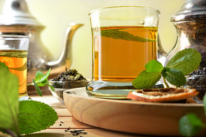 Green tea on a wooden table with ingredients elevated view, a Food & Drink Photo by Davizro's Market
