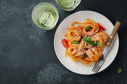 Tasty appetizing classic italian tagliatelle pasta with tomato sauce, cheese pa, a Food & Drink Photo by Budarinphoto