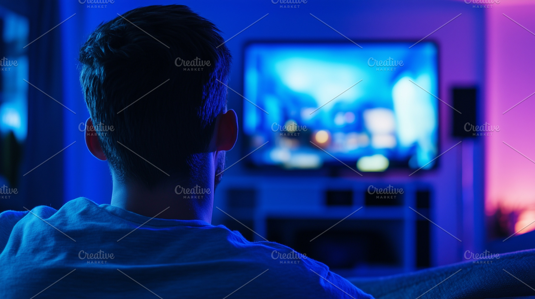 Rear view on a young man watching TV, a Person Photo by MistyDay