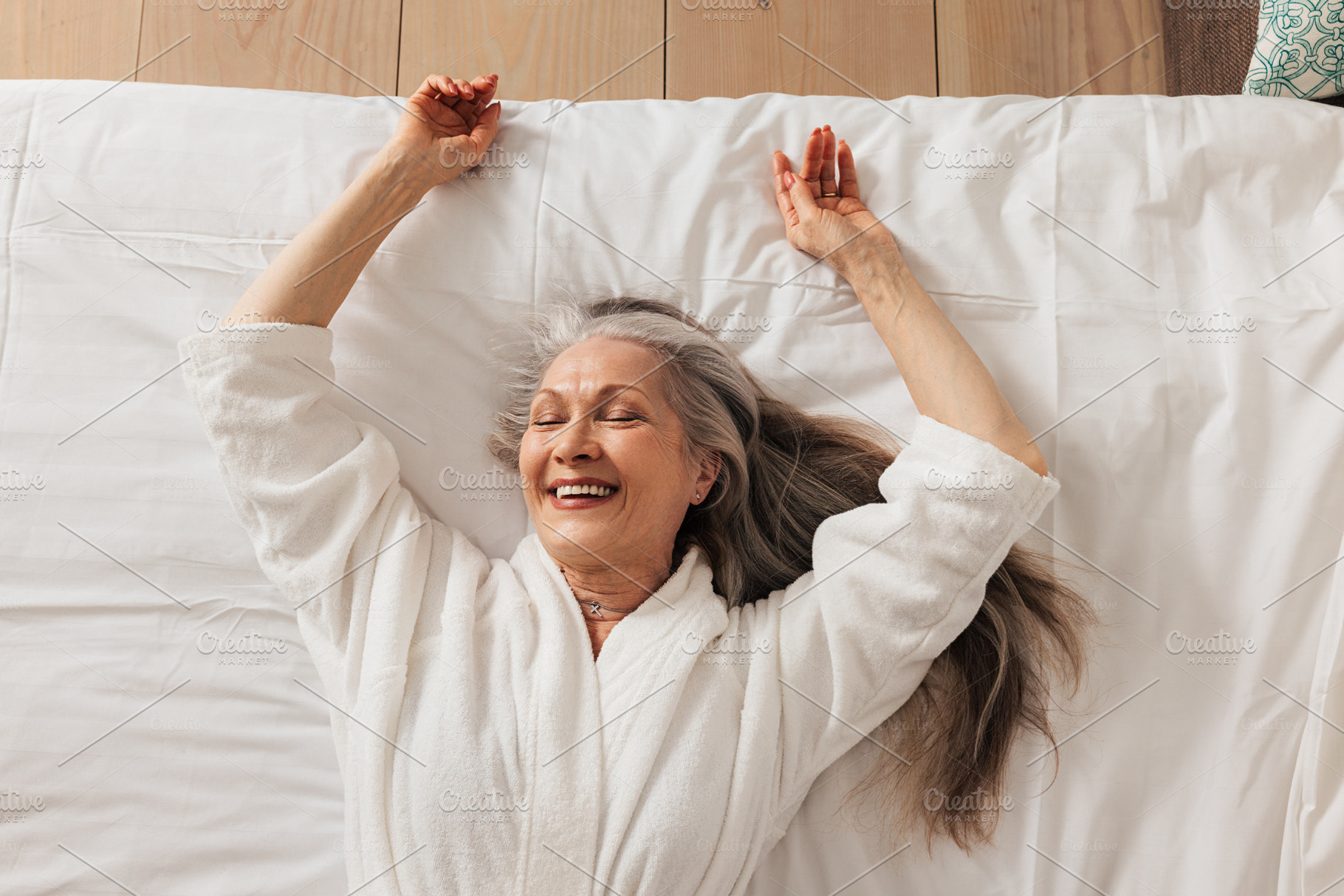 Happy aged woman in a bathrobe, a Person Photo by Artem Varnitsin
