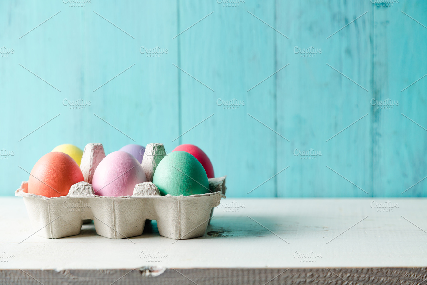 Pastel colored easter eggs in a egg stock photo containing easter and eggs, a Holiday Photo by asife