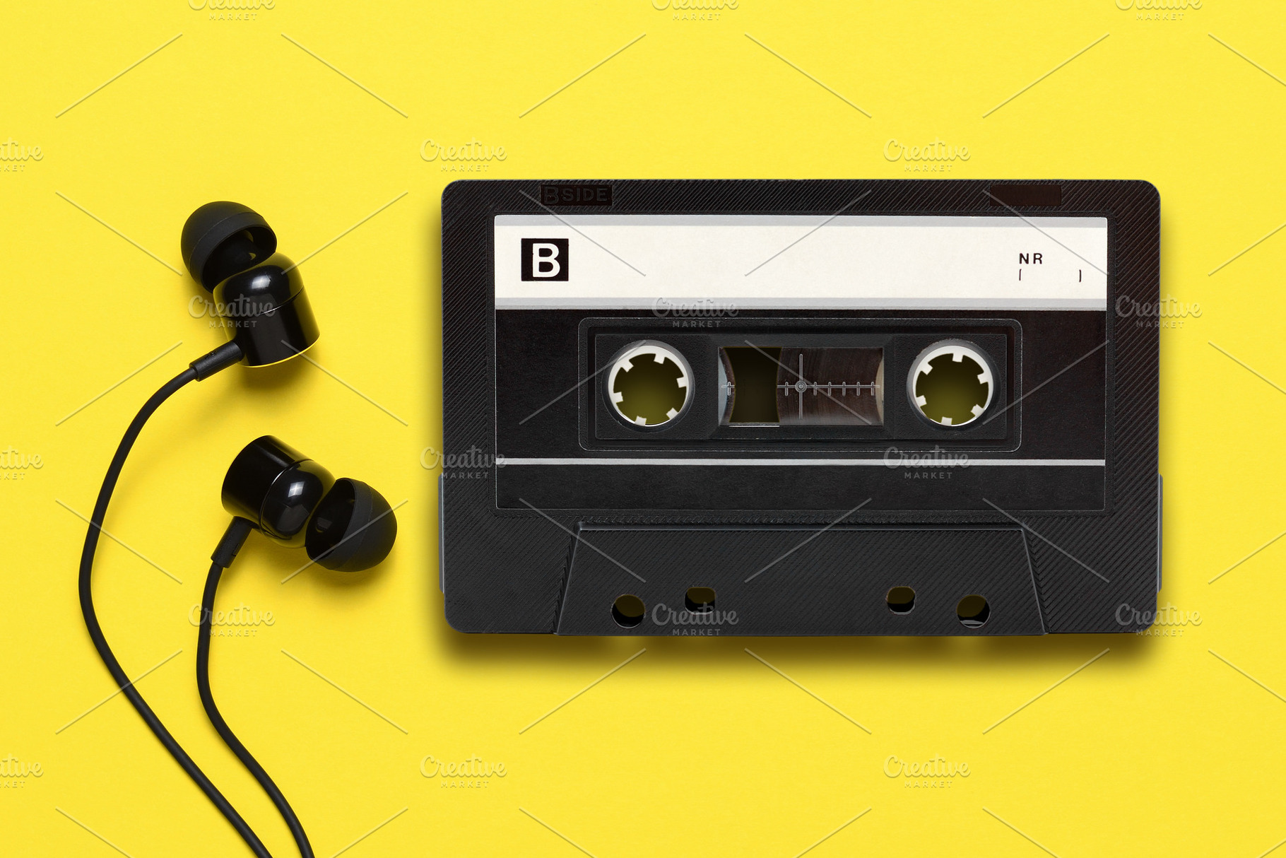 Earphones and audio cassette, a Technology Photo by Anatoliy Sadovskiy