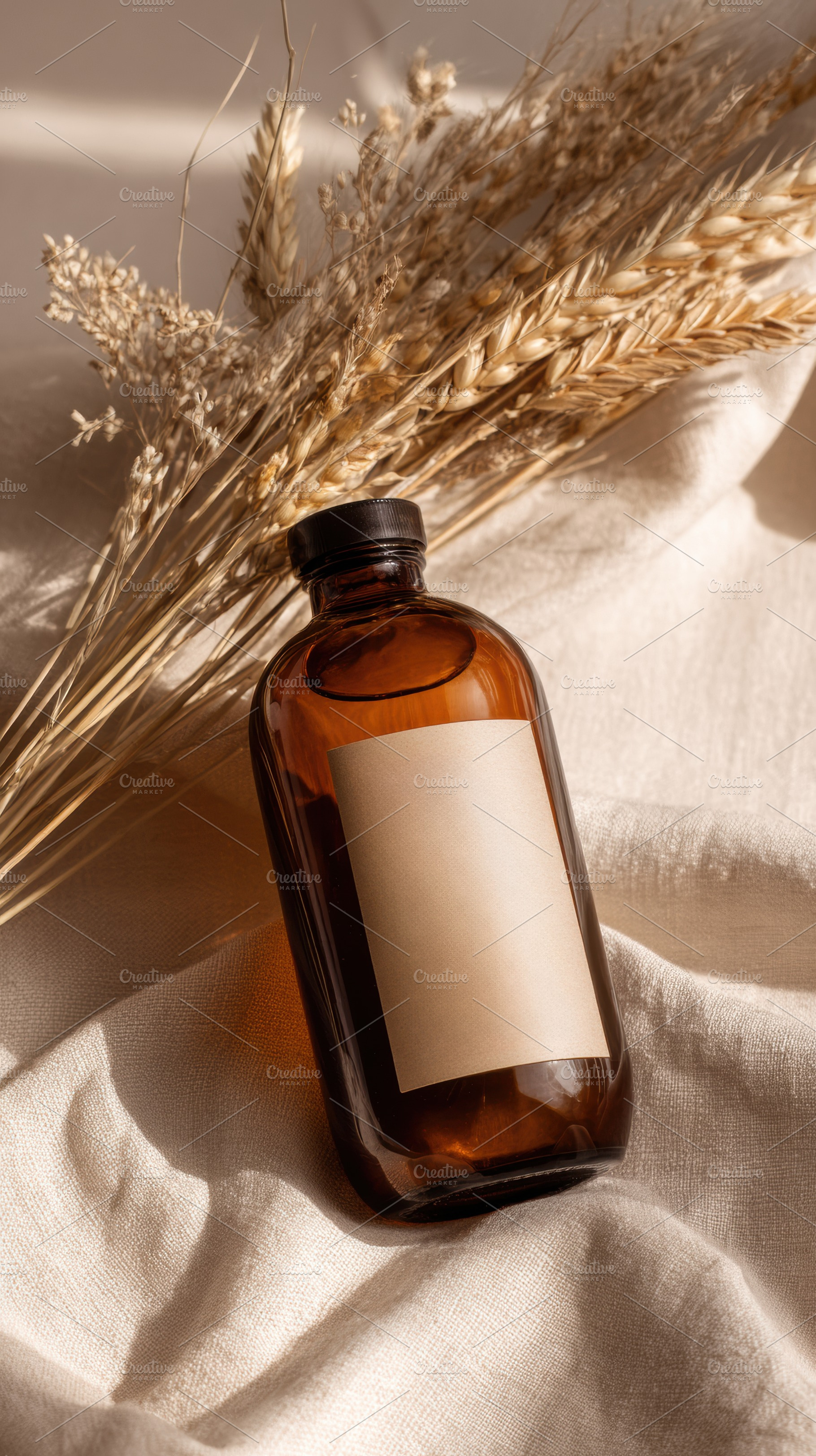 Dried wheat bouquet in amber bottle, a Beauty & Fashion Photo by Virgo Studio