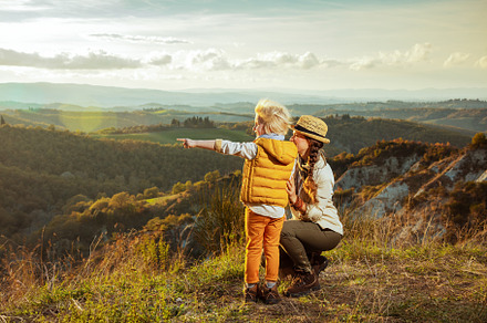modern mother and daughter pointing, a Person Photo by Alliance Images