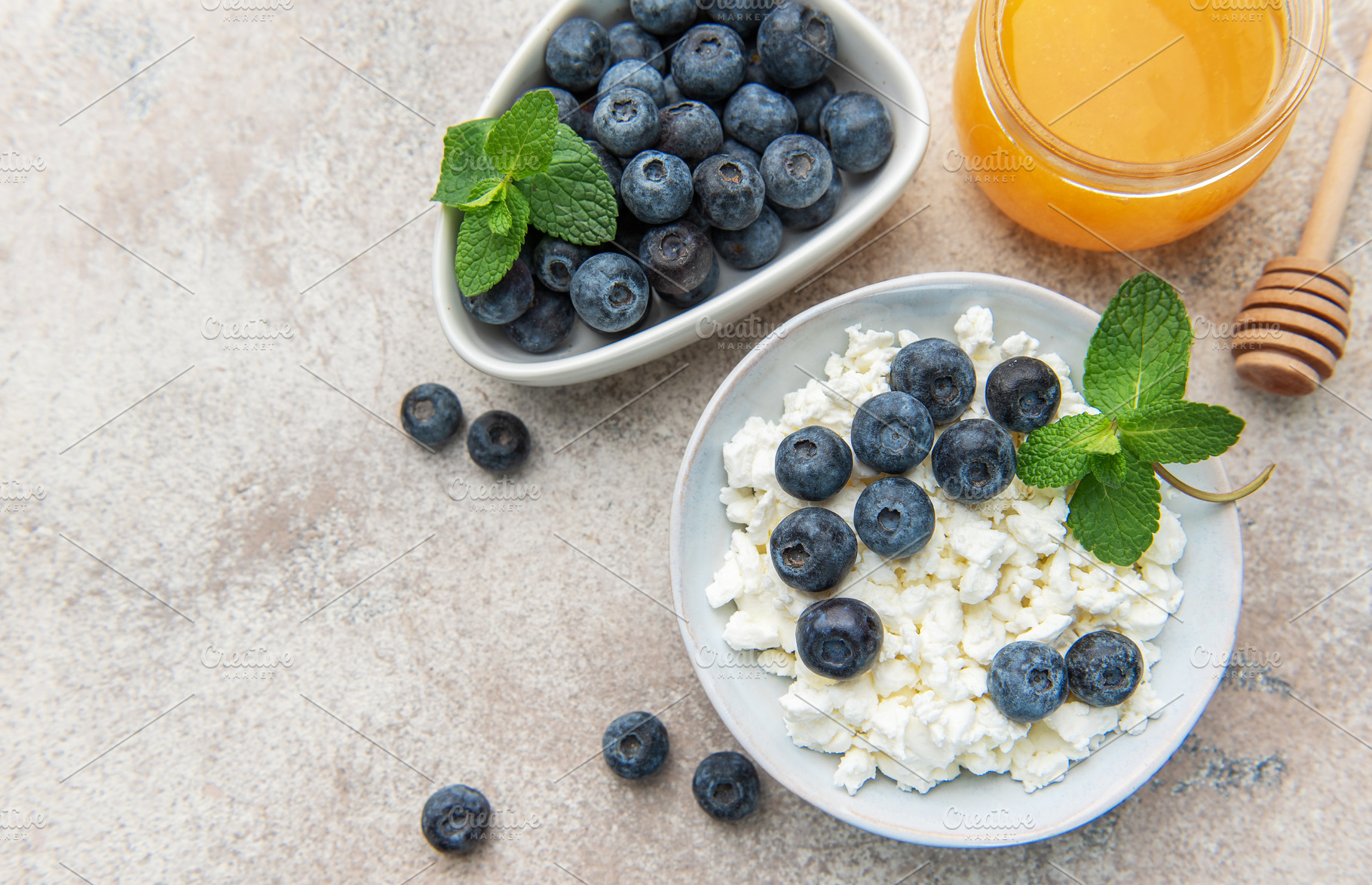 Cottage cheese, blueberries, honey, and mint forming healthy bre, a Food & Drink Photo by Olena Rudo