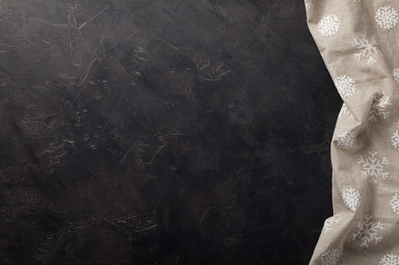 Kitchen stone dark table with towel. Top view with copy space, an Abstract Photo by Budarinphoto