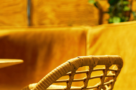 Spliced arm-chair in cafe interior background