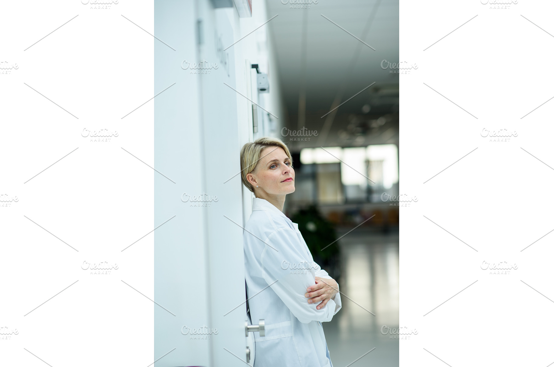 Tired female doctor leaning against, a Person Photo by HalfPoint