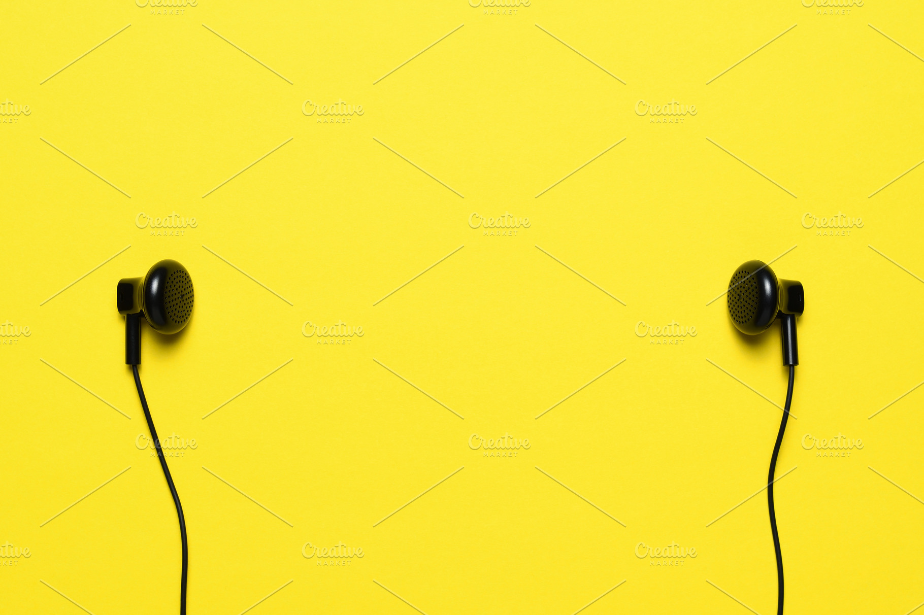 Headphones on yellow background, a Technology Photo by Anatoliy Sadovskiy