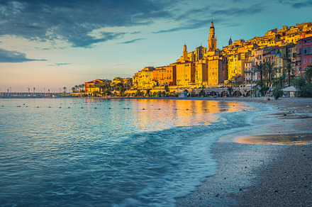 Seaside buildings at sunrise, an Architecture Photo by Alpine Dreams